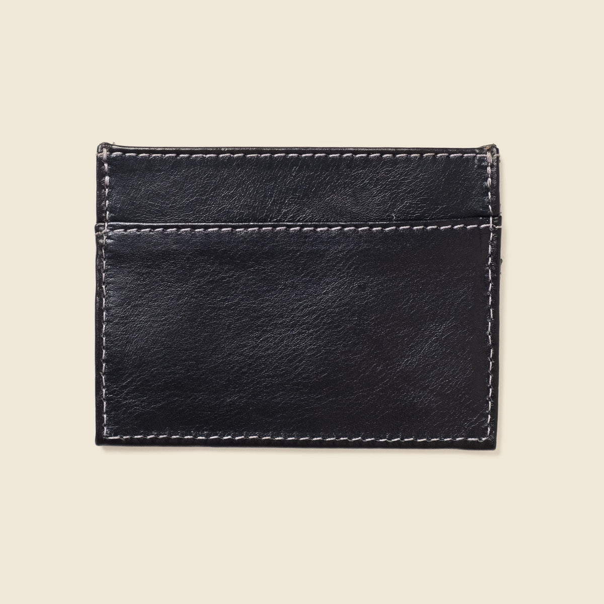 CASUPO slim card holder in black leather, back view