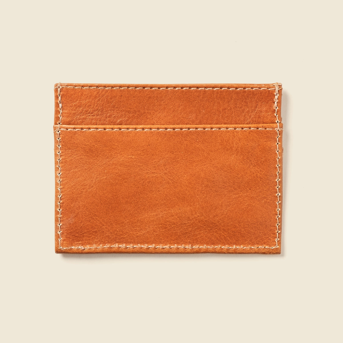CASUPO slim card holder in natural tan leather, back view